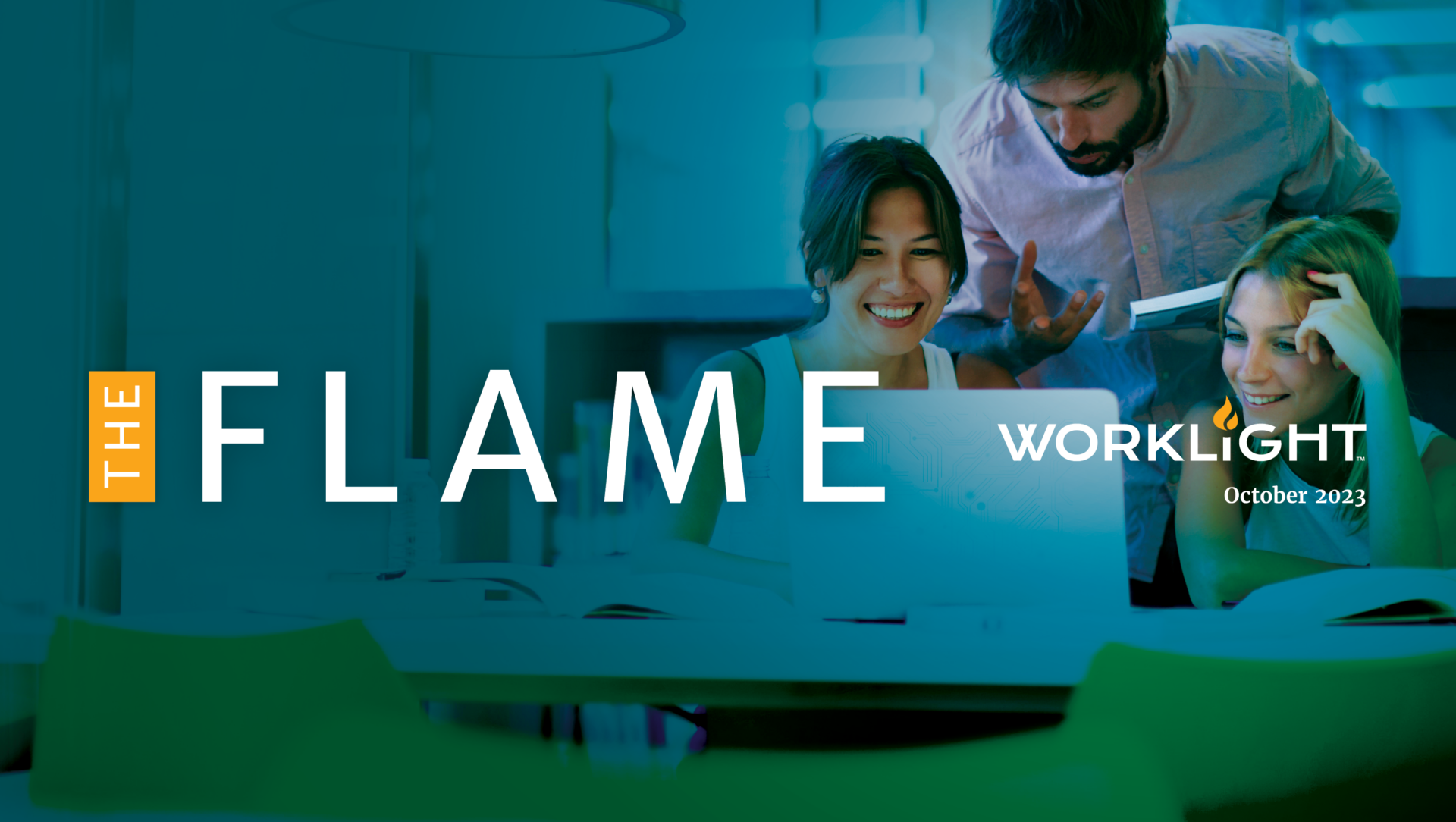 a man and two women looking at a computer screen. Over the image are the words "The Flame" and the WorkLight logo.
